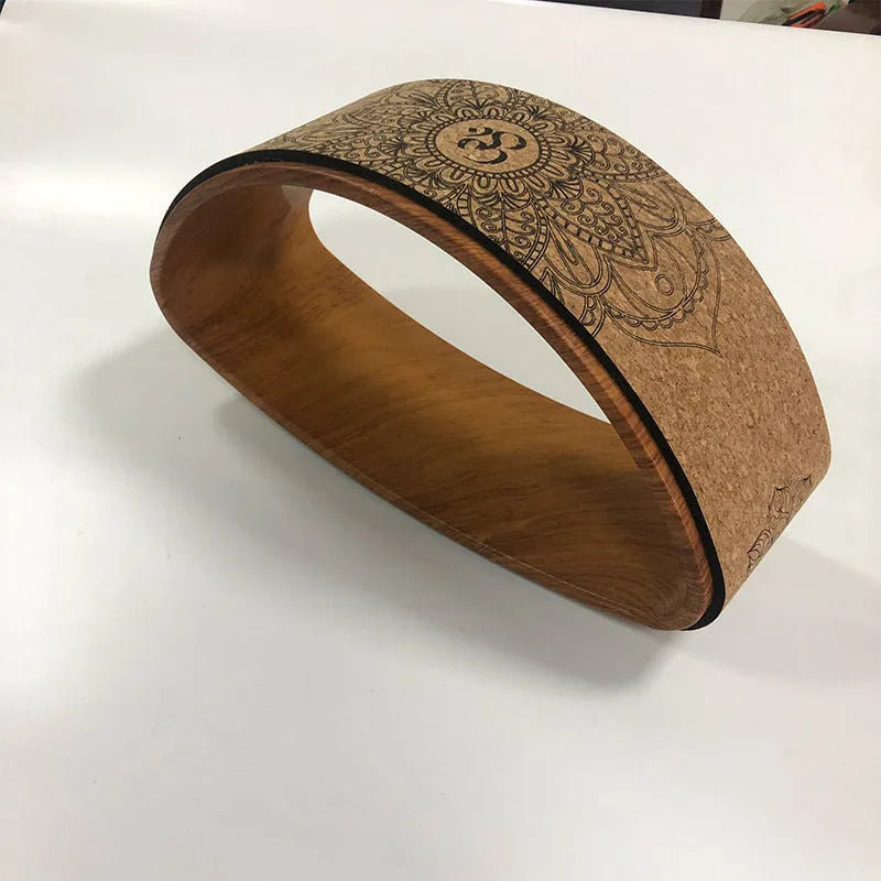 Cork yoga half wheel half-round backbend artifact in wood grain finish on floor
