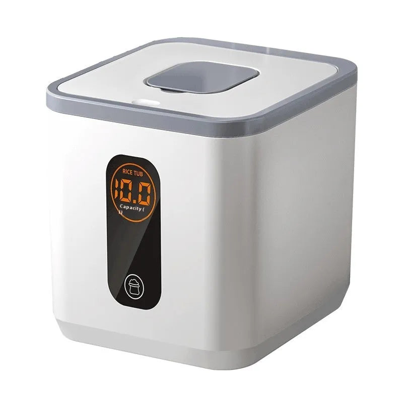 Simple grey plastic sealed rice storage jar with a measuring cup on a kitchen counter.