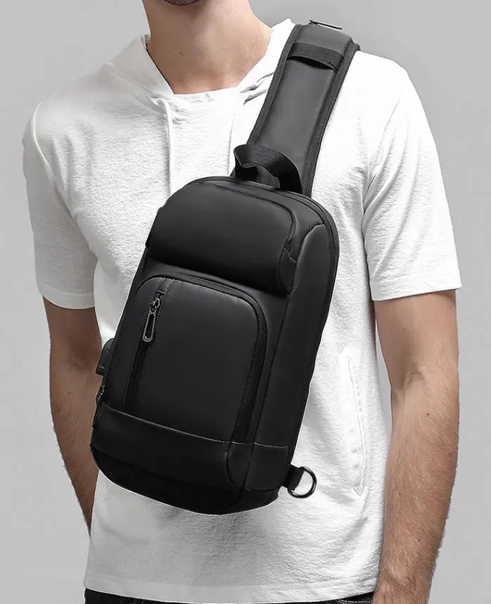 Black medium outdoor leisure shoulder bag showing square shape and single air cushion strap