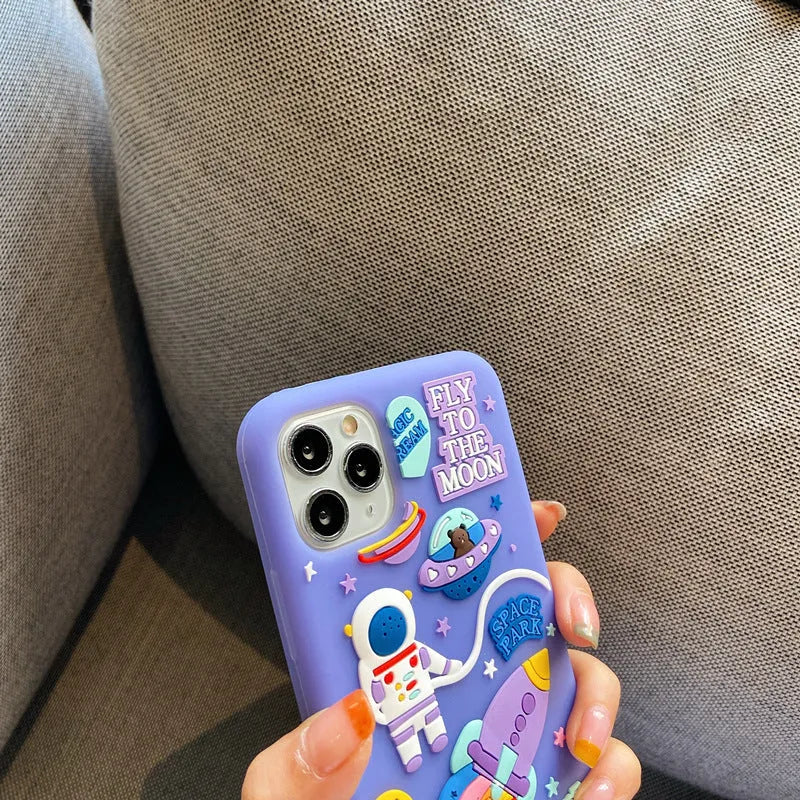 Purple silicone iPhone case with cartoon astronaut graphic for models 7, 8, X, and 11