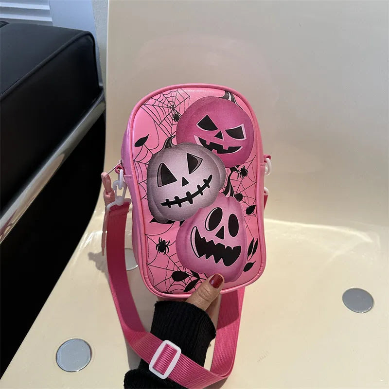Halloween graffiti print mini crossbody bag with cartoon pumpkin ghost bat design in multiple colours.