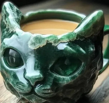 Handmade purple geode mug and crystal cat cup resin craft ornament on a table.