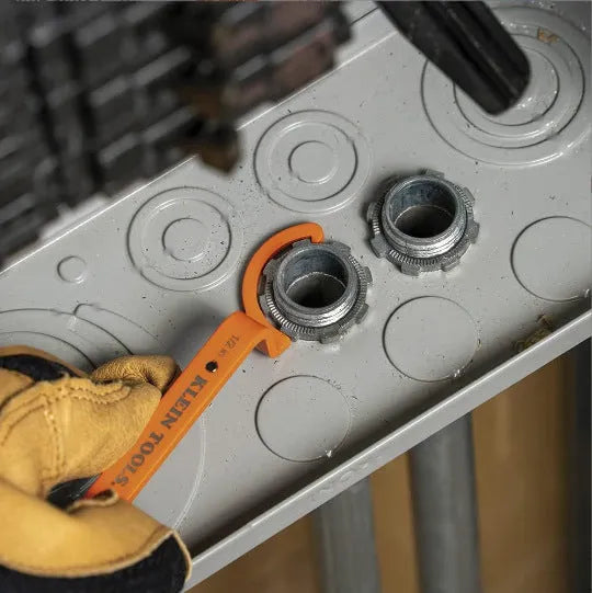 Orange, grey, and black magnetic crescent wrenches with catheter locking, shown together as a three-piece set.