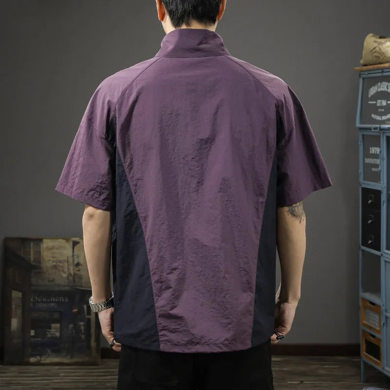 Brown men's short-sleeve half-zip shirt with a stand collar, showing the loose fit and ice silk fabric texture.