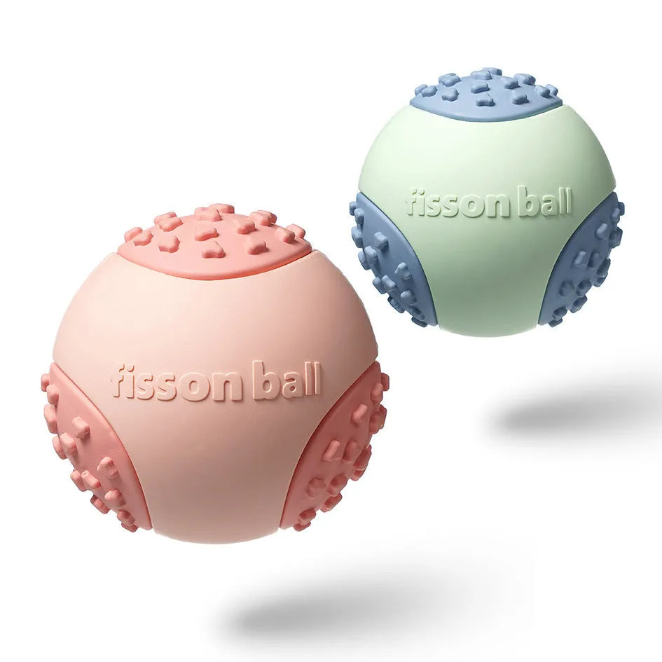 Green and pink durable plastic rolling ball dog toy with 64mm diameter.