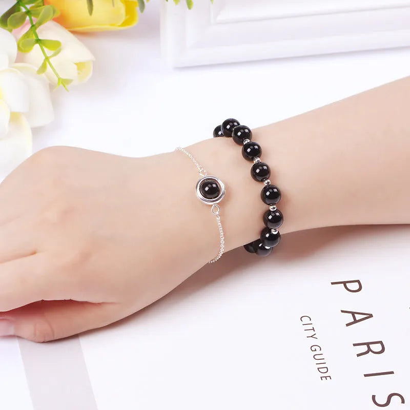 Double-layer women's bracelet with crystal beads and lucky charms in gold electroplated finish