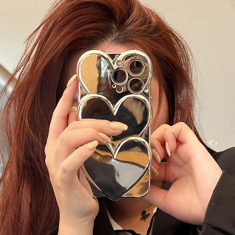 Soft TPU iPhone case with shiny 3D electroplating love design, shown next to matching bracelet.