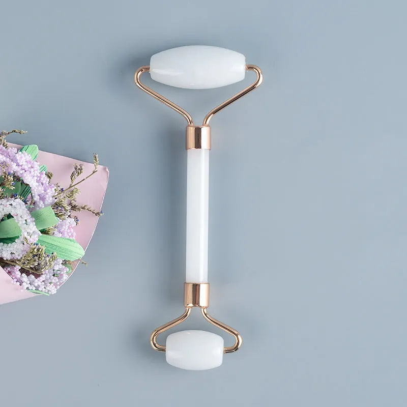 White jade double-headed roller and scraping board set for facial and body massage.