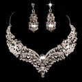 Alloy crystal rhinestone necklace and earring set with butterfly dragon serpent pattern on white background
