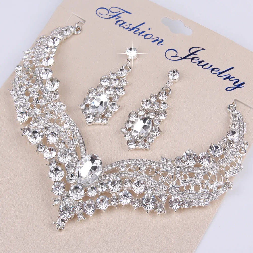 Alloy crystal rhinestone necklace and earring set with butterfly dragon serpent pattern on white background