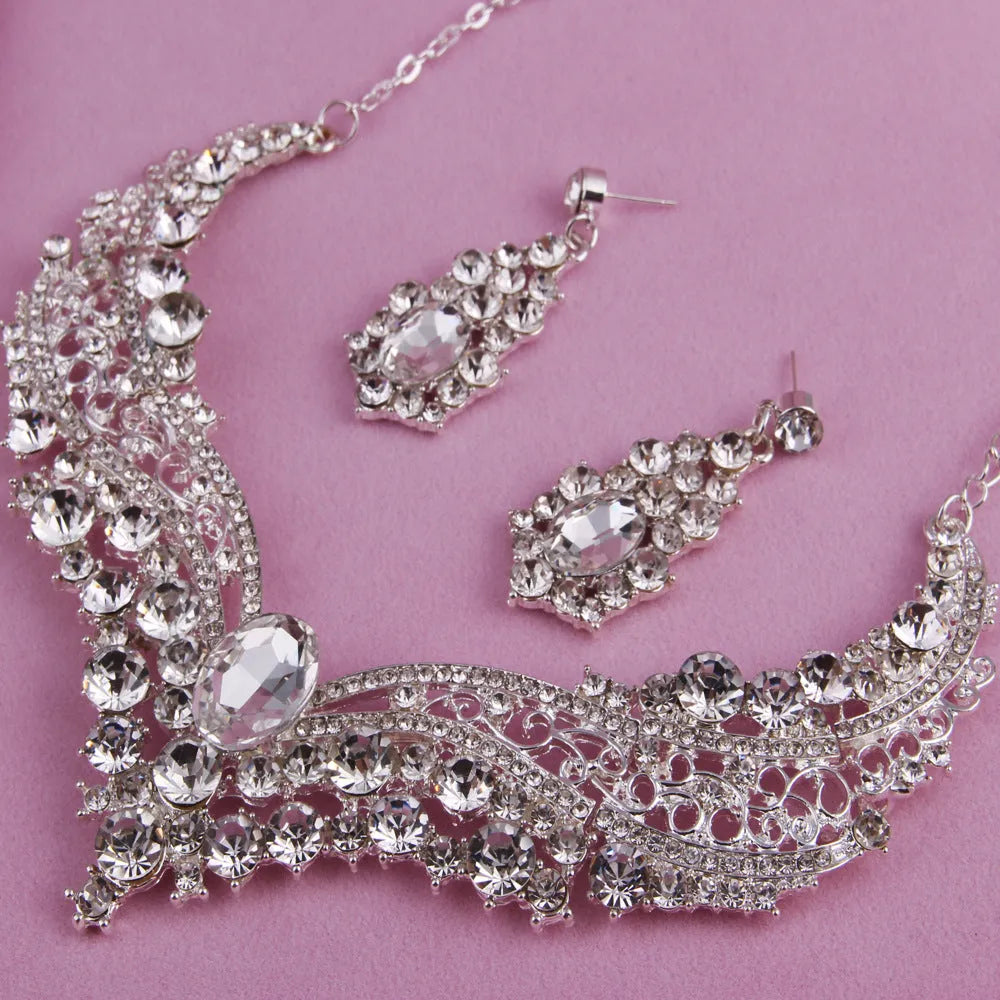Alloy crystal rhinestone necklace and earring set with butterfly dragon serpent pattern on white background