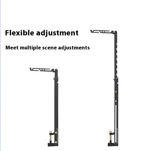 Black stainless steel telescopic lamp holder with gear adjustment mechanism on a desk edge.