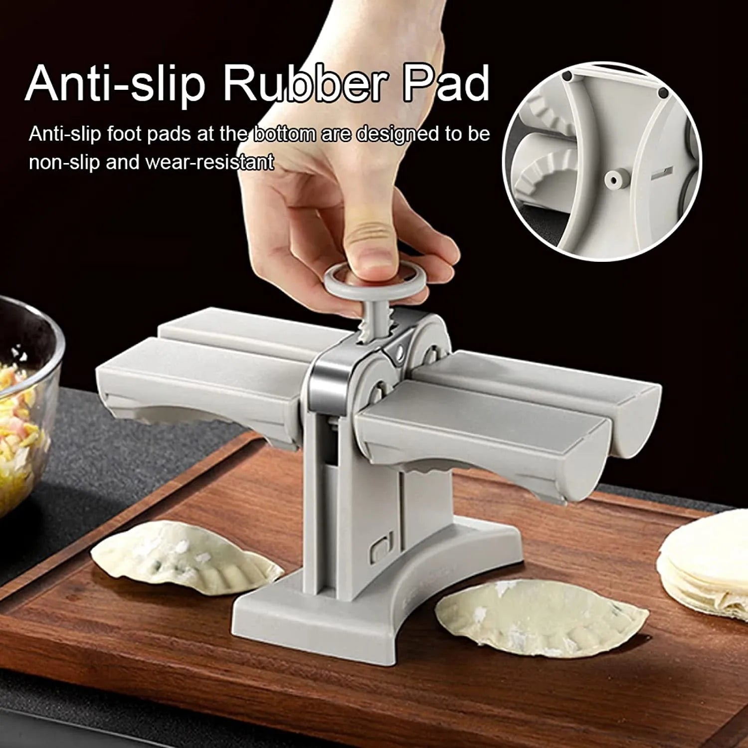 White plastic manual dumpling maker with double head press and anti-slip rubber base mat.