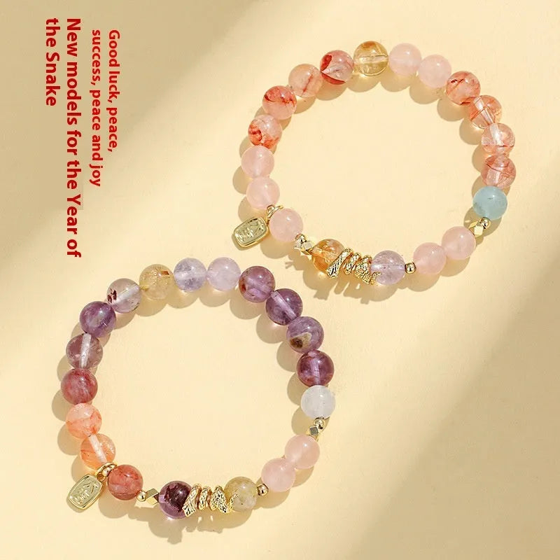 Women's crystal bead bracelet with lucky snake charms and colourful plastic flower accents