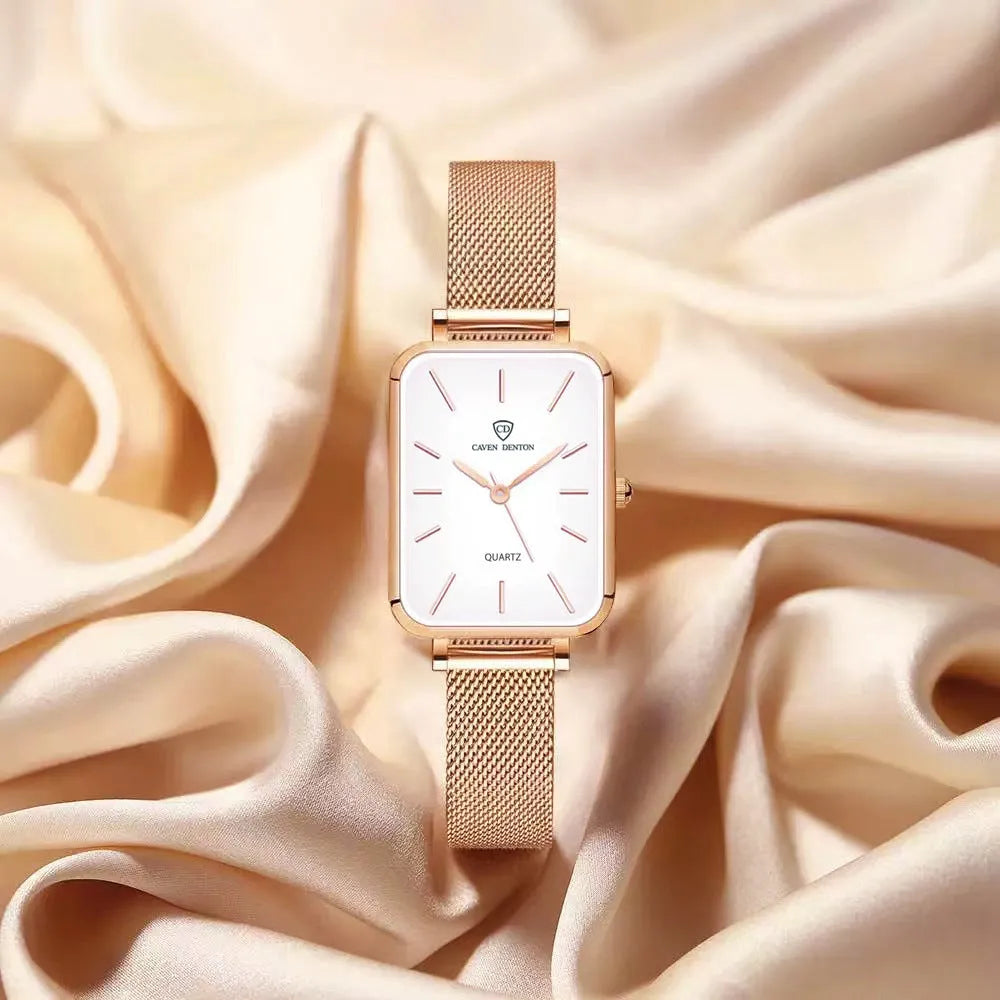 Women's rose gold waterproof quartz watch with woven steel strap on wrist.