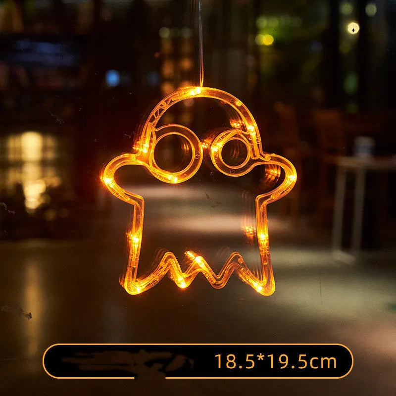 Halloween LED window lights with suction cups showing ghost, spider, and pumpkin decorations