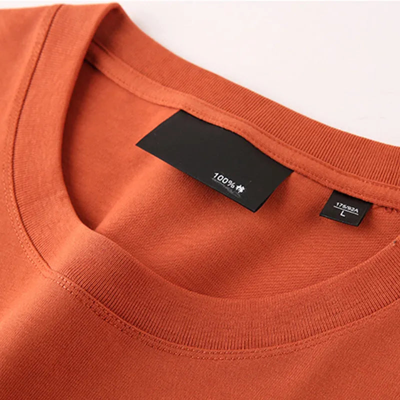 Men's solid colour loose fit cotton t-shirt with round neck and drop shoulder sleeves