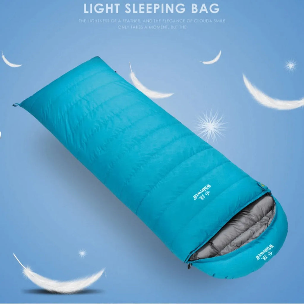 Black outdoor sleeping bag with envelope design, shown with a bladeless fan accessory.