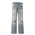 Men's blue straight-leg ripped jeans on a white background showing retro detailing and zip fly