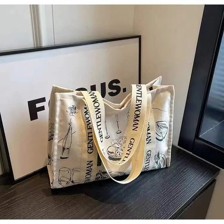 Canvas tote bag with printed design, available in black letters, coloured letters, and pattern style options.