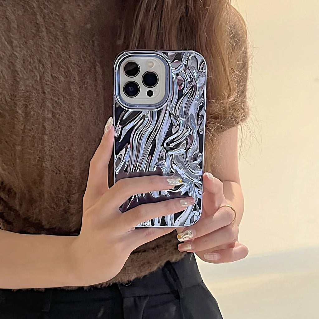 Soft TPU iPhone case with a textured three-dimensional pleated pattern in an electroplated silver finish.