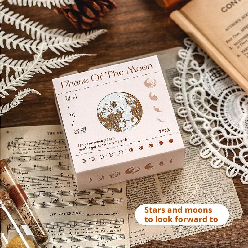 Mr Paper Seal Suit wooden stamp set showing seven stamps in either stars and moon or botanical designs on a craft table.