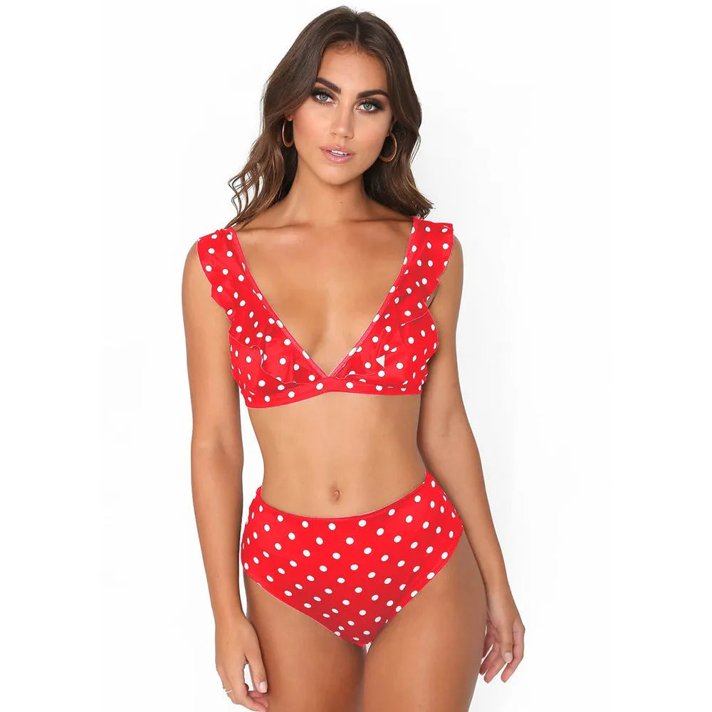 Black and white polka dot women's bikini set with a deep V-neck top and ruffled trim.