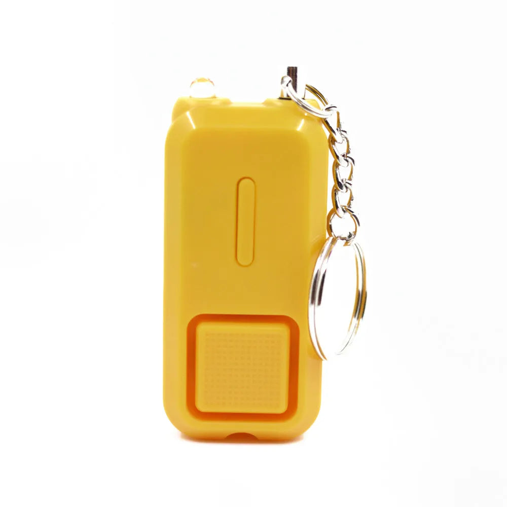 Pink personal safety alarm keychain with button, shown next to its white product box.