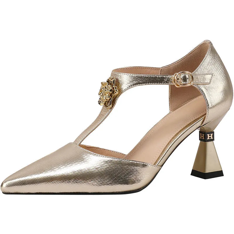 Women's gold genuine leather hollowed sandals with a pointed toe on a white background.