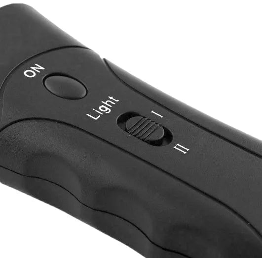Black ABS ultrasonic dog repeller and training flashlight, 14cm x 6cm x 3cm, 130dB, 20m range