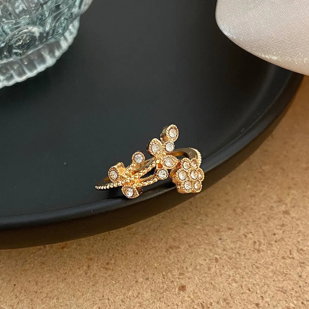 Women's copper open ring with floral leaf design in gold or white colour