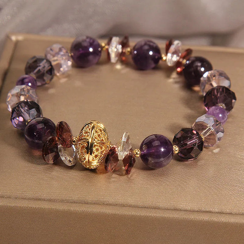 Purple crystal pumpkin bead bracelet with wind chime charms and rhinestone accents for women