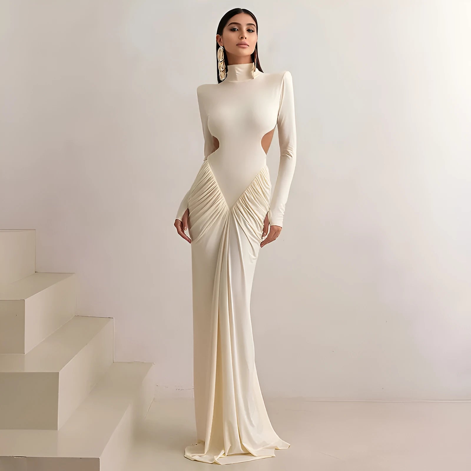 A woman's long sleeve high collar slim fit pleated backless formal dress in a solid colour.