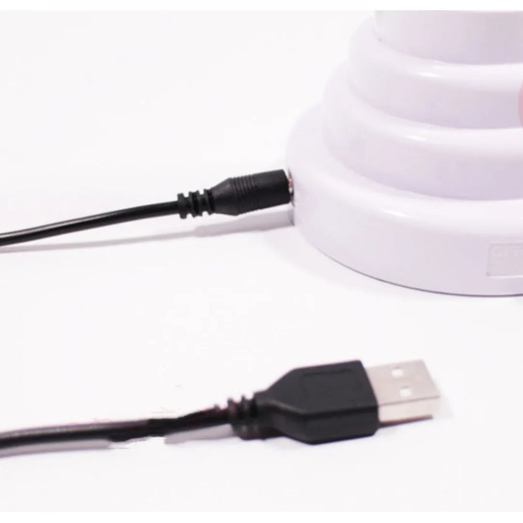 Minimalist white bamboo-shaped desktop lamp with a green glow, shown in two size options.