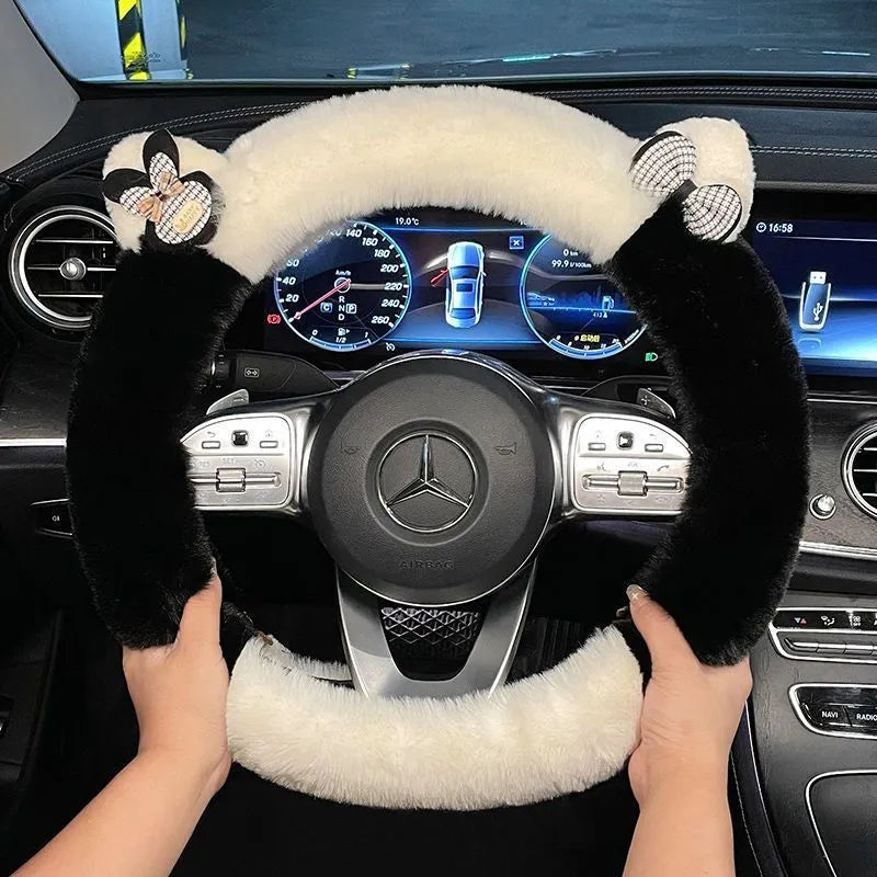 Milk tea white plush steering wheel cover with panda ears on a car steering wheel