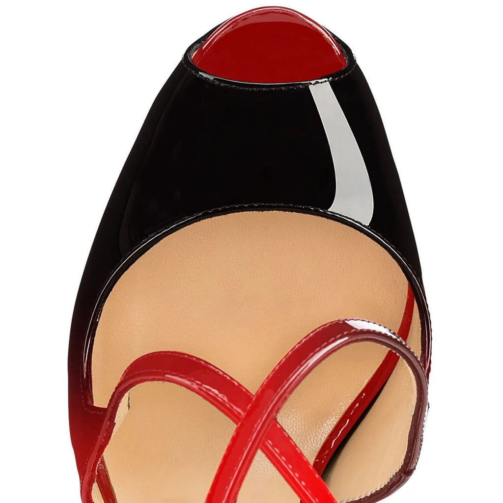 Women's black peep toe high heel shoes with a matching cross strap fastened around the ankle.