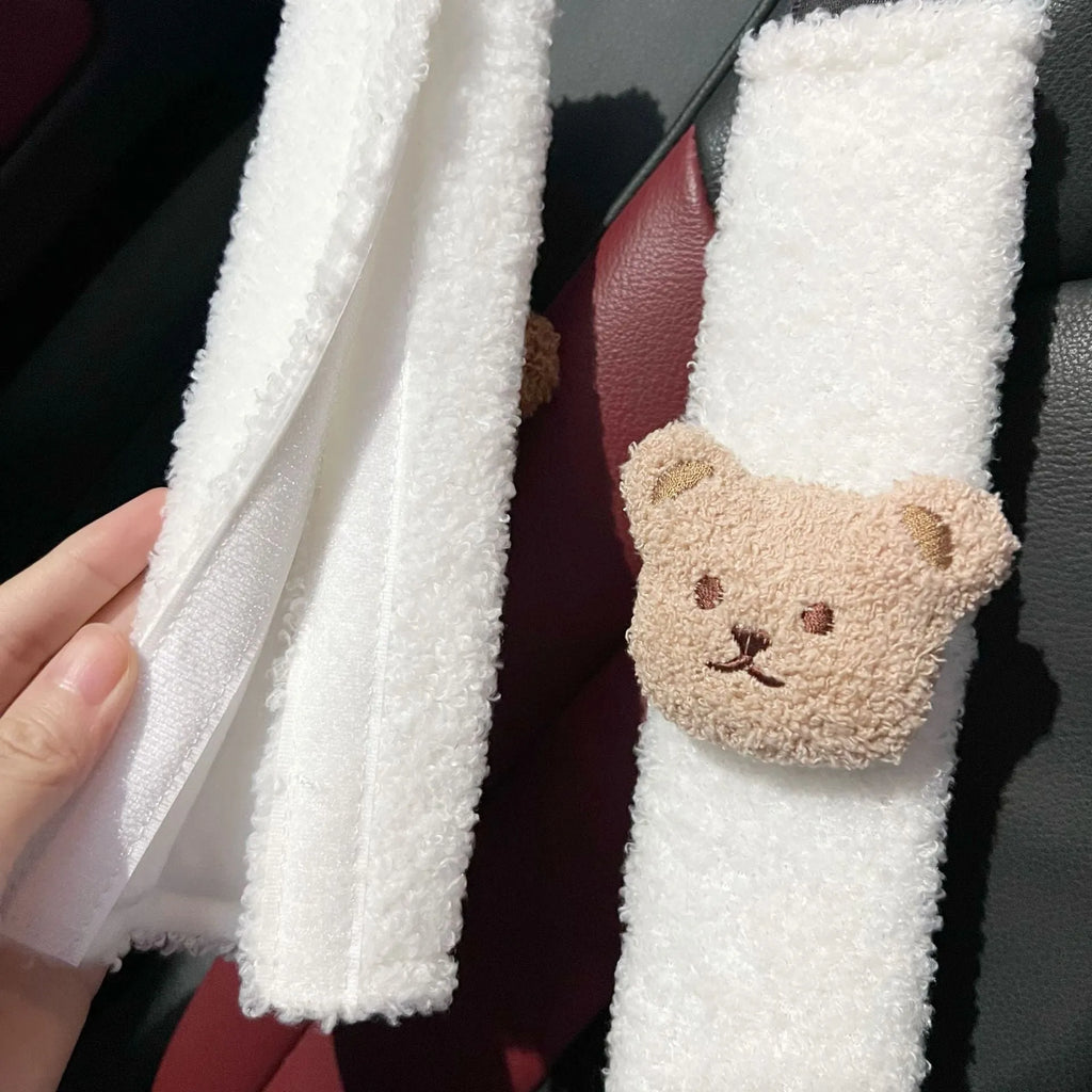 Cartoon bear plush seat belt cover for baby car seats showing khaki and coffee colour options