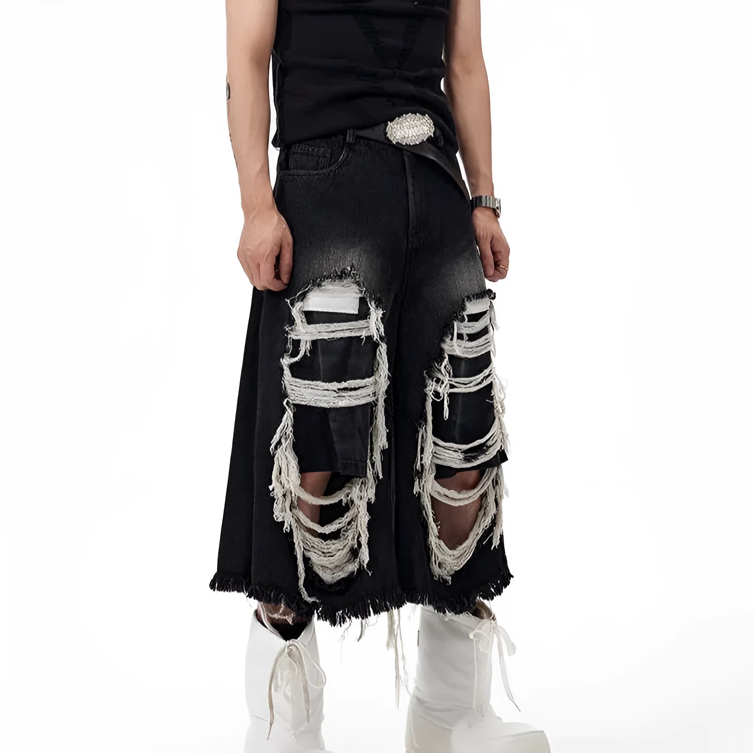 Black wide leg cropped jeans with distressed patch details and a mid-high waist.