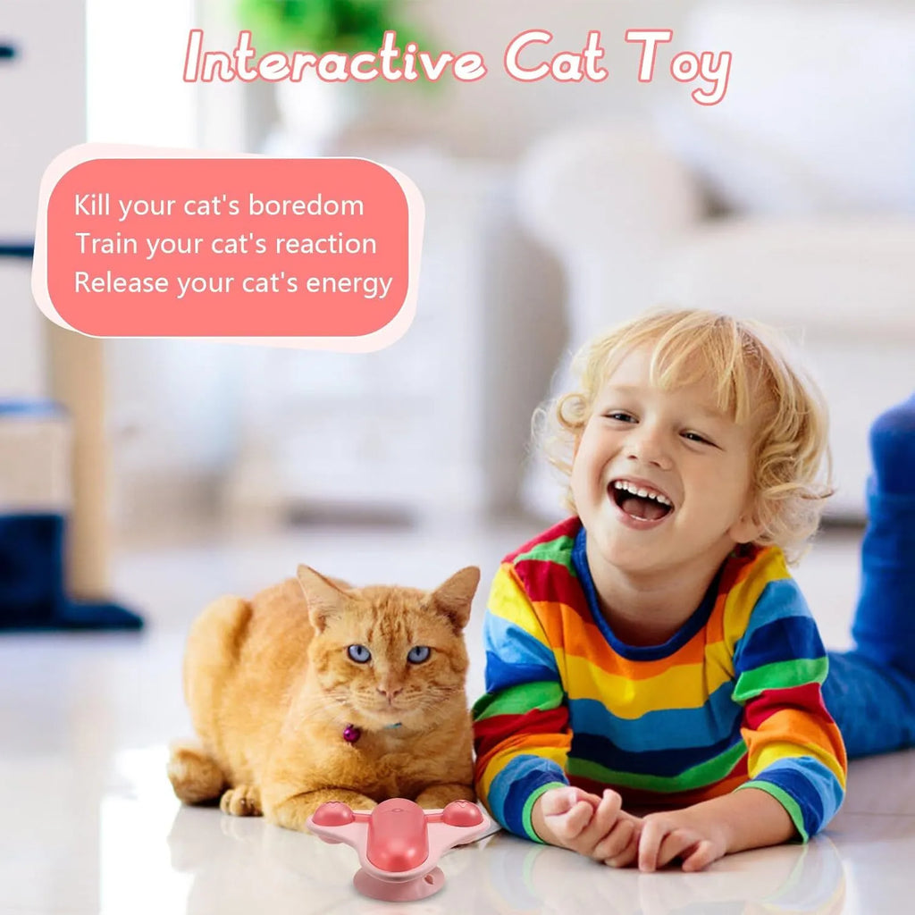 Blue interactive pet puzzle toy with airplane cabin snack dispenser, bell, and catnip on a suction cup base