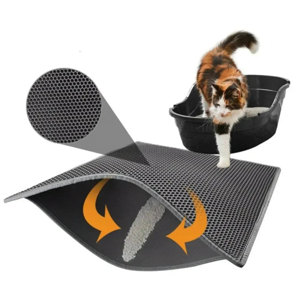 Black EVA foam cat litter pad with honeycomb design beside litter box