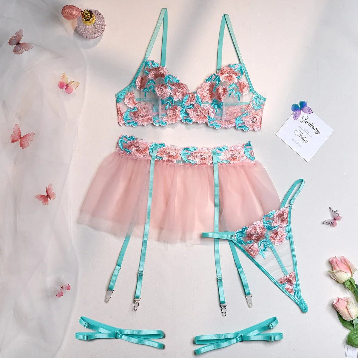 Pink embroidered mesh women's pettiskirt suit with matching bikini set on size chart