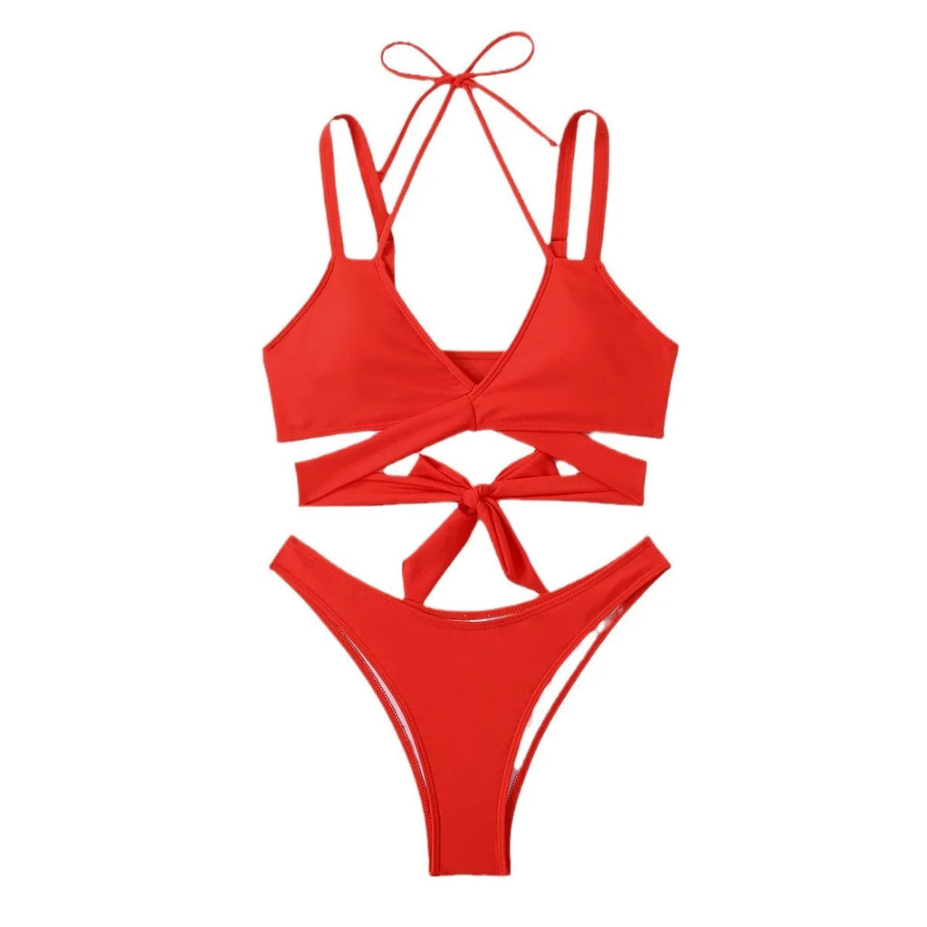 Women's solid colour strappy bikini swimsuit on a hanger, showing the briefs style and strap design.