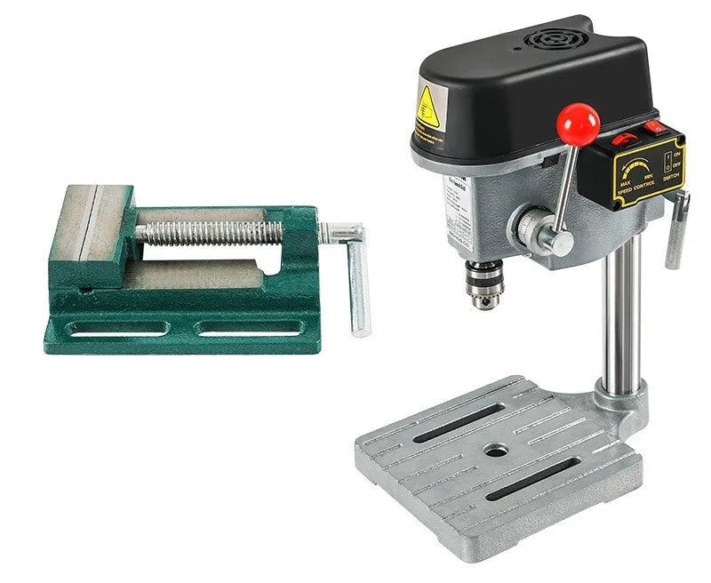 Mini bench drill milling machine on a workbench with optional pliers or drill accessories.