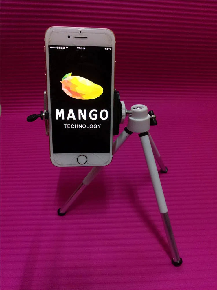 Black aluminium desktop phone holder with adjustable two-section bracket on a wooden desk