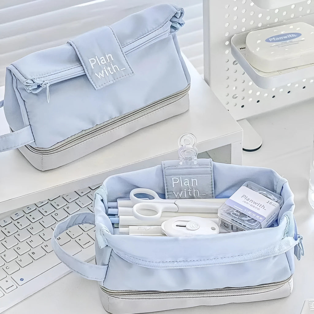 Double-layer folding pencil case in polyester fabric, shown in navy blue colour.