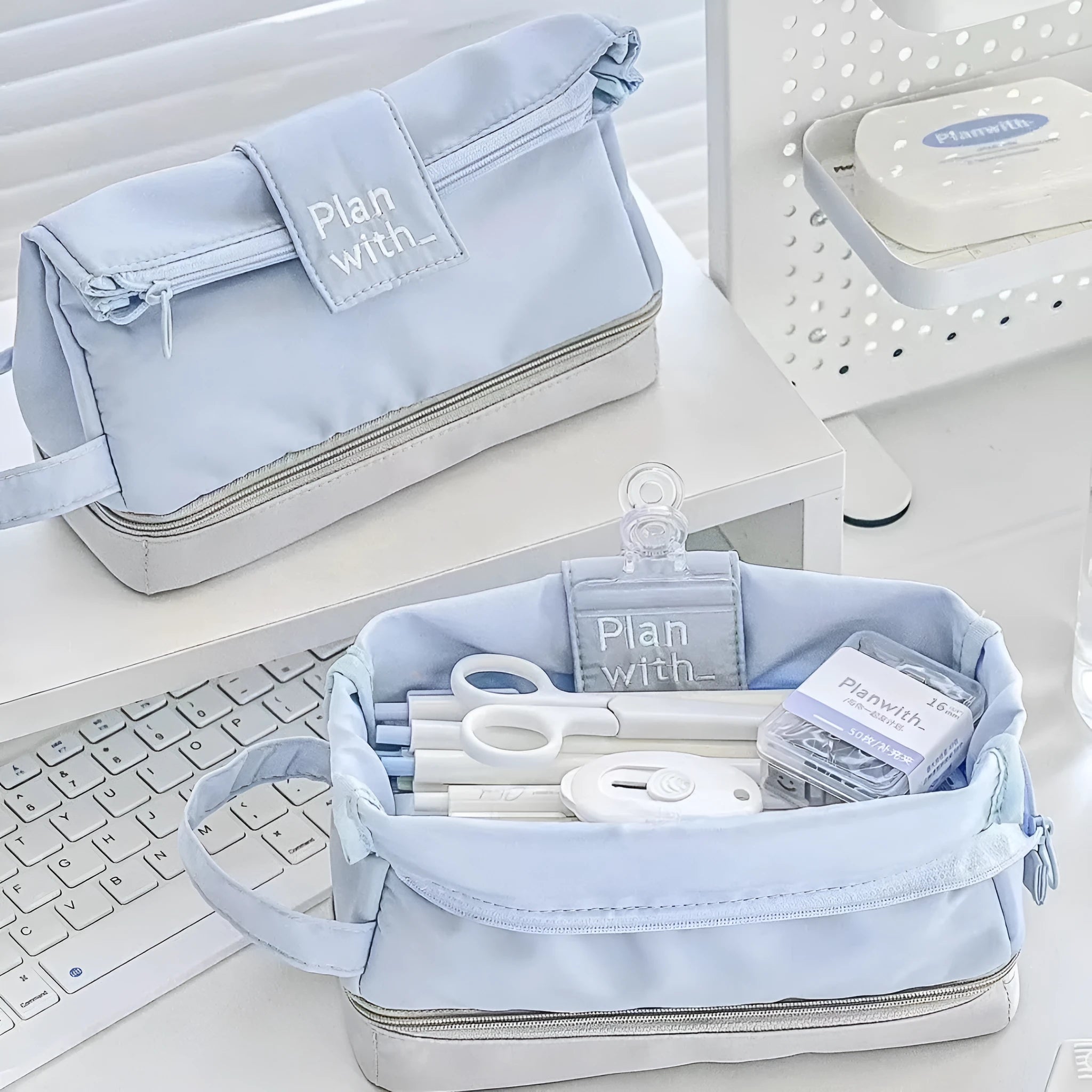 Double-layer folding pencil case in polyester fabric, shown in navy blue colour.