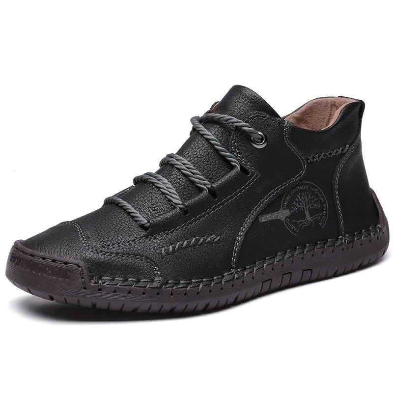 Men's brown leather high-top boots with visible stitching and flat rubber sole on a neutral background.