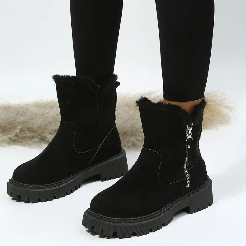 Women's black faux suede high-top snow boot with side zipper on a non-slip rubber sole.