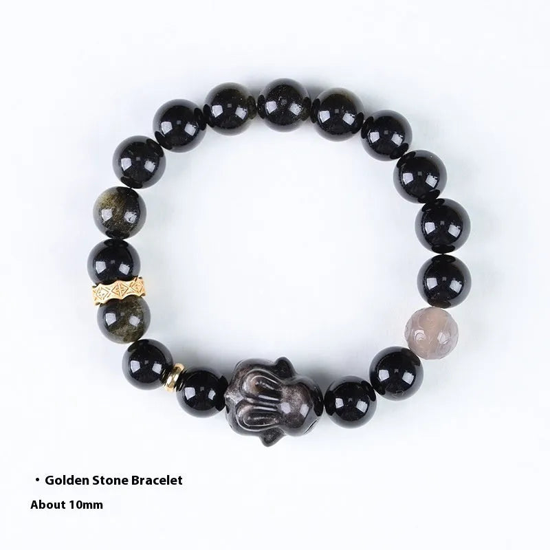 Handmade obsidian bracelet with lying rabbit charm, grey agate accents, and Yaoshi metallic elements in traditional national style