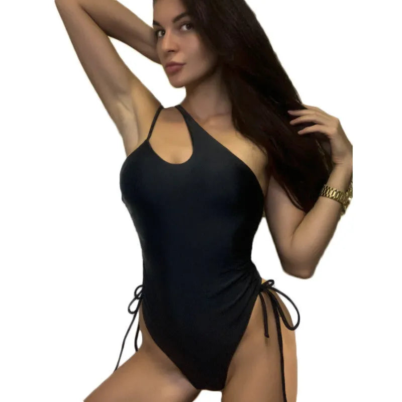 Black women's dress with sloping shoulder lacing detailing, sleeveless tight fit design